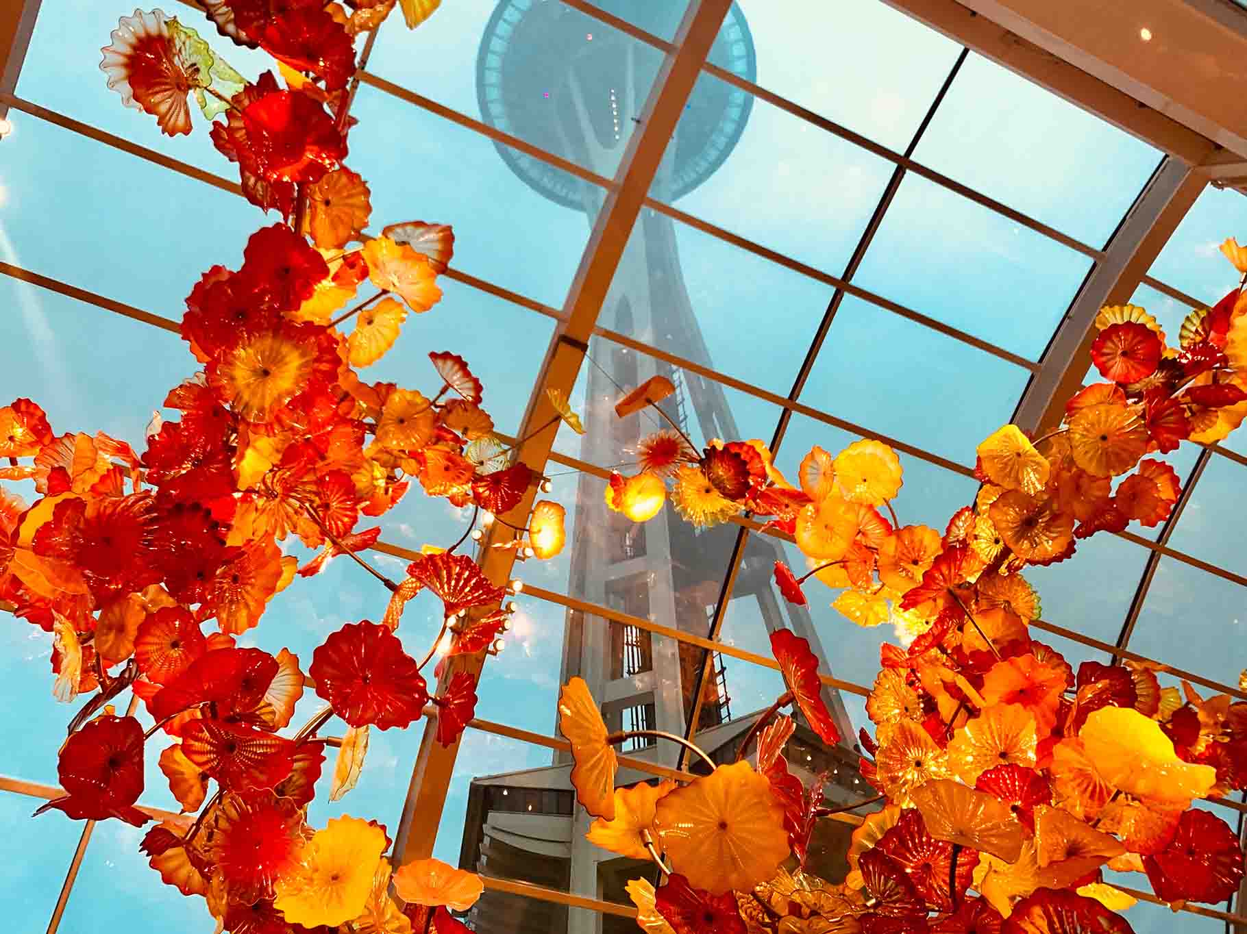 Space Needle seen through orange glass sculpture